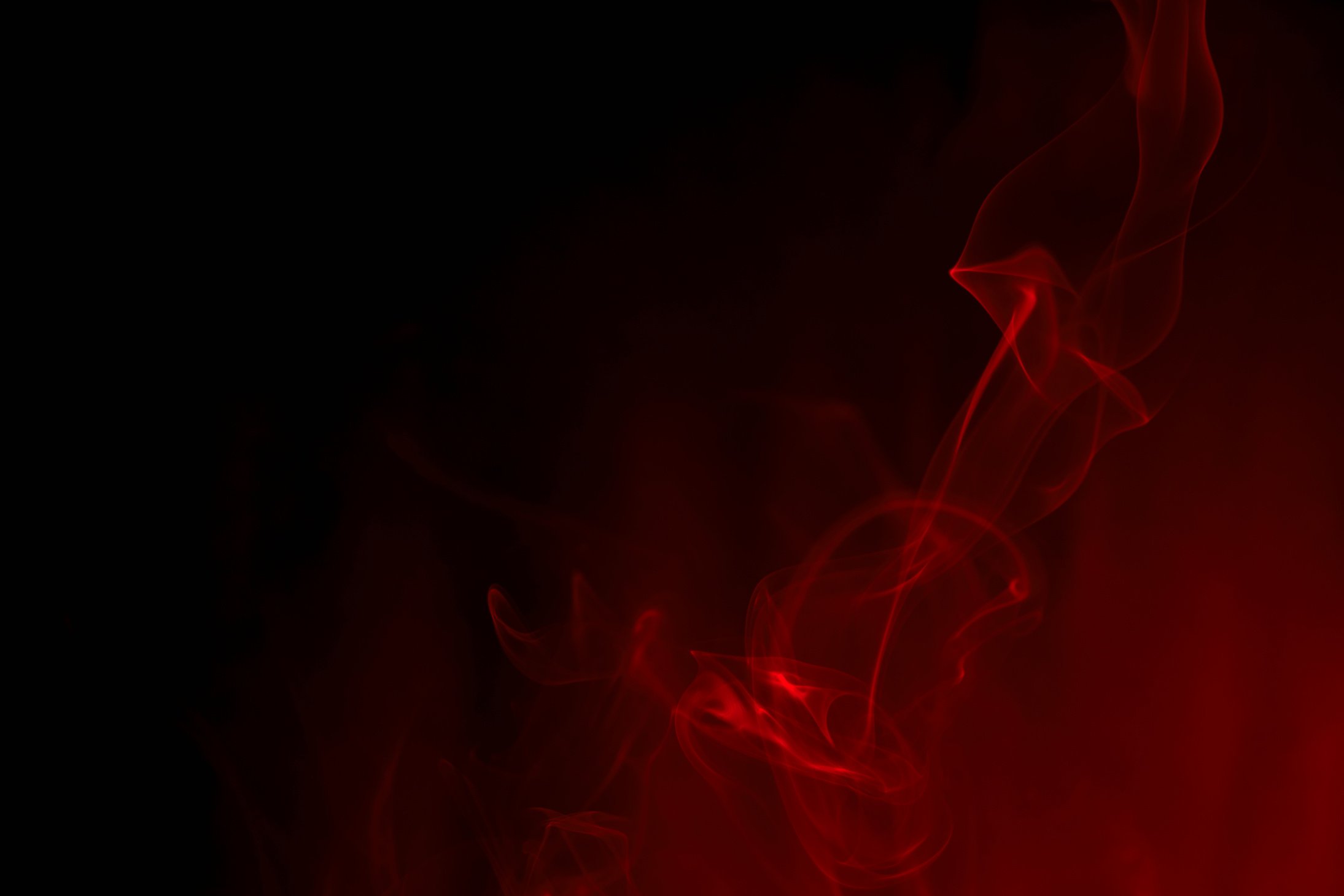 red smoke on black background